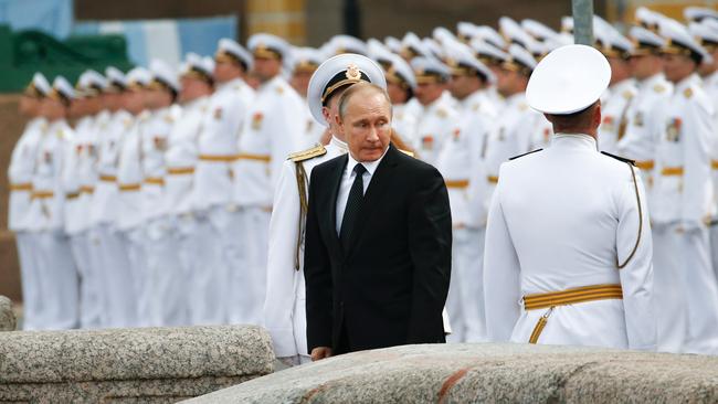 Vladimir Putin attends a military parade during Navy Day celebrations in Saint Petersburg in 2017. Picture: AFP