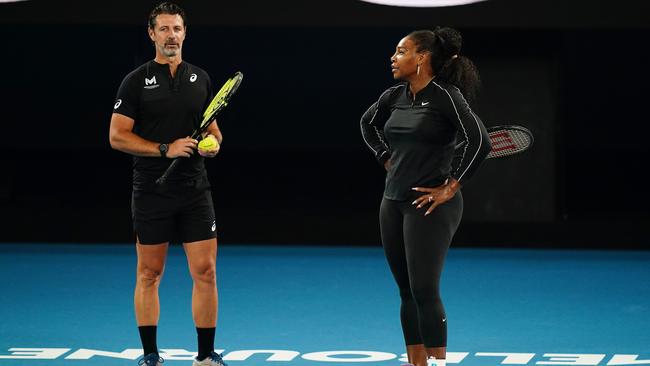 Serena Williams talks with her coach Patrick Mouratoglou during an Australian Open practice session at Melbourne Park on Thursday. Picture: AAP