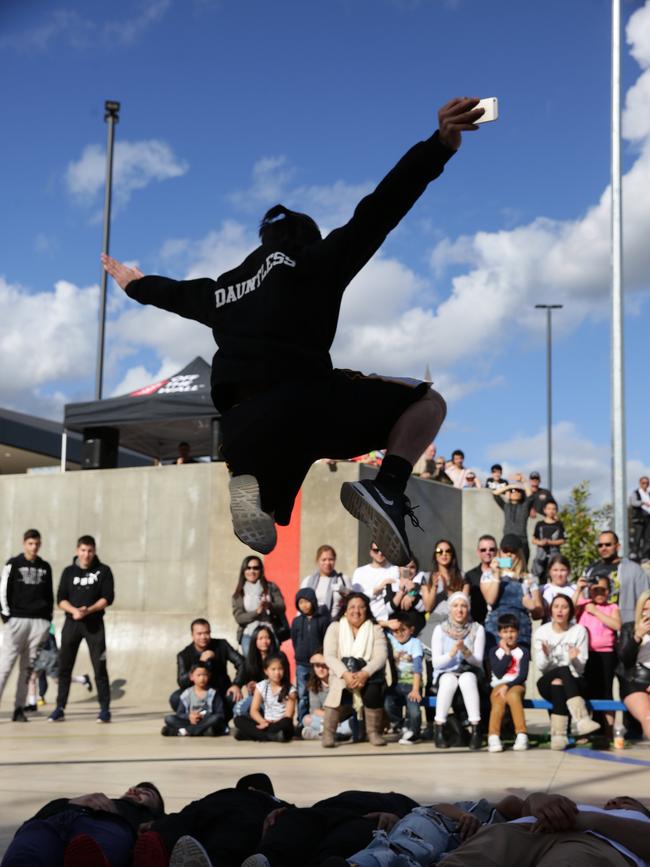 Parkour performers at the Carnes Hill Community and Recreation Precinct. The precinct includes a skate park, the Michael Clarke recreation centre, and a library.