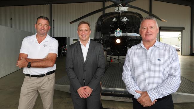 Member for Barron River, Craig Crawford, Queensland Premier Steven Miles and Member for Cairns, Michael Healy with Townsville’s police helicopter. Picture: Annette Dew