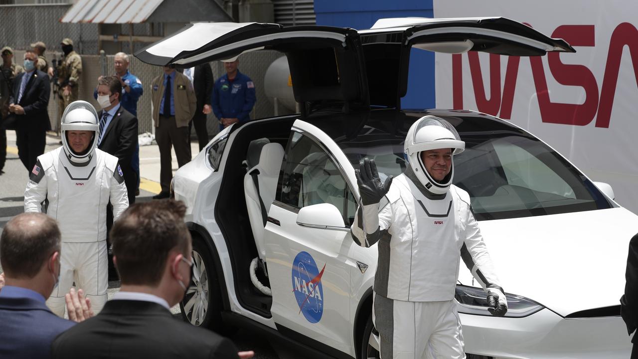 NASA and SpaceX are trying to send two astronauts into space, and appropriately a Tesla is taking them to and from the launch pad. Picture: John Raoux/AP