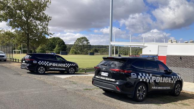 Police cars near the search area.