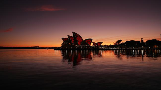 The Opera House at dawn on Remembrance Day, 2022. Picture: John Grainger