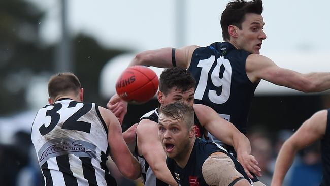 Berwick and Narre Warren players battle for the ball. Picture: Josie Hayden