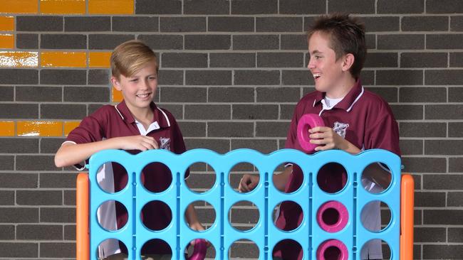 Students Dylan Molesd and PJ Grasso in the playground of the news Rowland Hassell School in Chester Hill. Picture: Simon Bullard