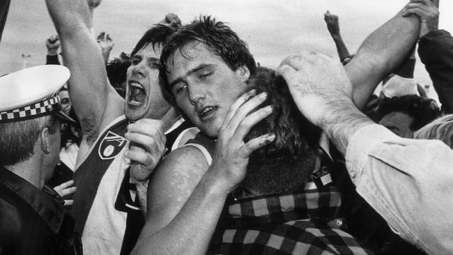 St Kilda captain Danny Frawley with Tony Lockett after a win over the Hawks.