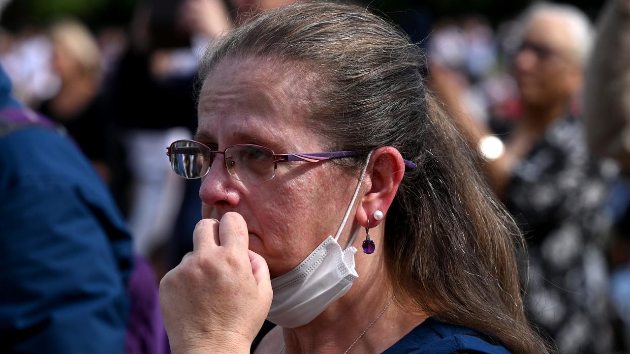 A tearful mourner watches the procession for Queen Elizabeth II at the Hyde Park screening site. Picture: Stuart C. Wilson/Getty Images