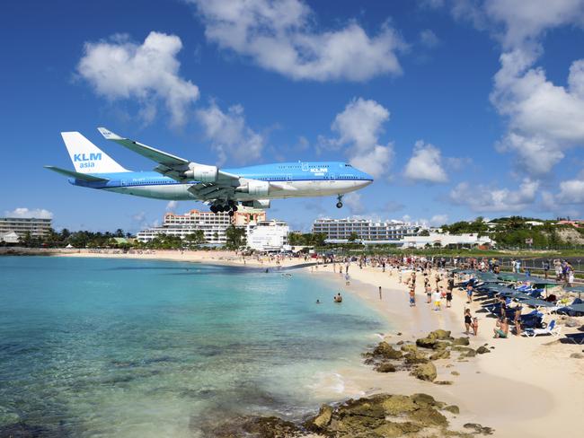 St Maarten is famous for the low-flying planes arriving at Princess Juliana International Airport and is a major tourist destination. Picture: Getty Images