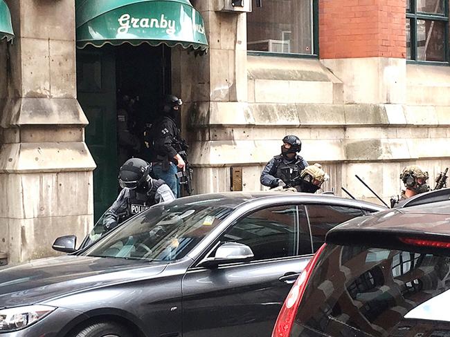 Some of the police wore gas masks. Picture: @louisebolotin