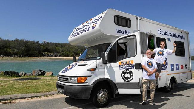 Ronald McDonald and William Bourke from the Sustainable Australia Party, pose for a photograph in front of their Voter Van at Kingscliff. Picture: Scott Davis