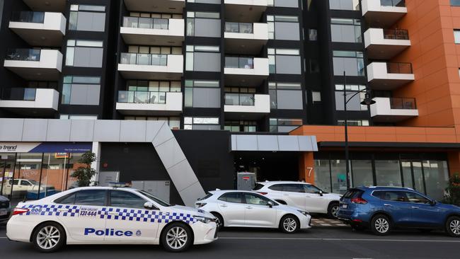 Police at the Ariele apartment complex, which was visited by a crew of infected removalists. Picture: Asanka Ratnayake/Getty Images