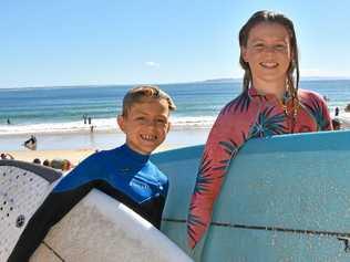 NOOSA HOLIDAYS: Locals Lachlan and Eve Jenner post surf at Noosa Beach. Picture: Caitlin Zerafa