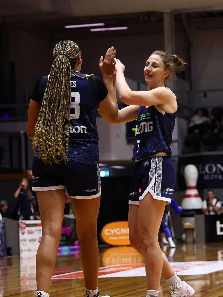 Haley Jones and Sarah Elsworthy celebrate during Thursday night’s win over Southside Flyers. Picture: Graham Denholm/Getty Images