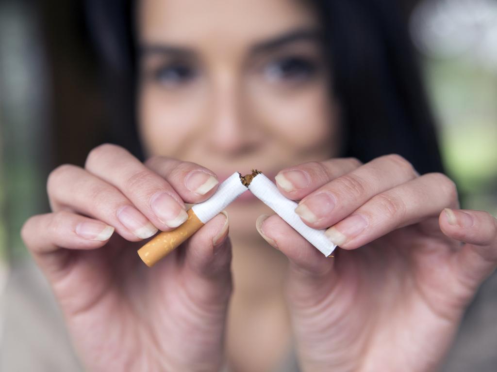 beautiful young woman breaks a cigarette as a gesture for quit smoking Picture: istock