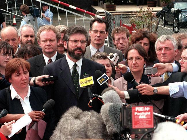 Sinn Fein leader Gerry Adams (C) and Martin McGuinness (centre left) arrive at the historic first session of the newly-elected Northern Ireland Assembly in 1998 Picture: Alan Lewis/AFP