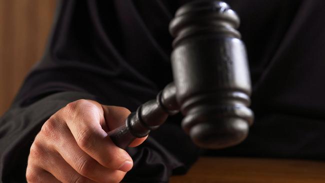 Generic image of a judge hitting a gavel. In a courtroom . Credit : Thinkstock