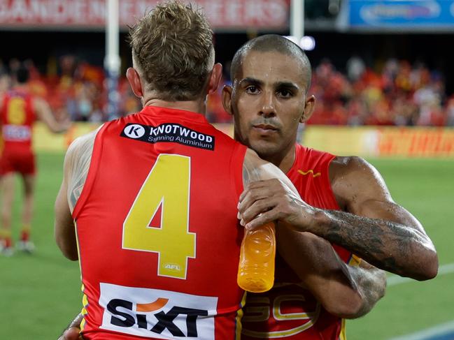 GOLD COAST, AUSTRALIA – MARCH 09: Touk Miller and Brandon Ellis of the Suns celebrate after the 2024 AFL Opening Round match between the Gold Coast SUNS and the Richmond Tigers at People First Stadium on March 09, 2024 in Gold Coast, Australia. (Photo by Russell Freeman/AFL Photos via Getty Images)