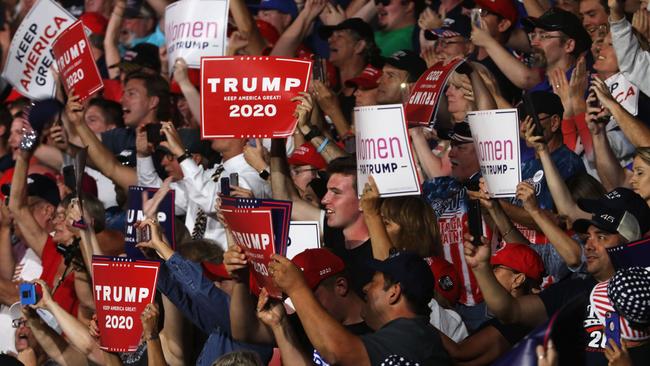 People cheer as President Donald Trump speaks to supporters at a rally in Manchester on August 15, 2019 in Manchester, New Hampshire. Spencer Platt/Getty Images/AFP