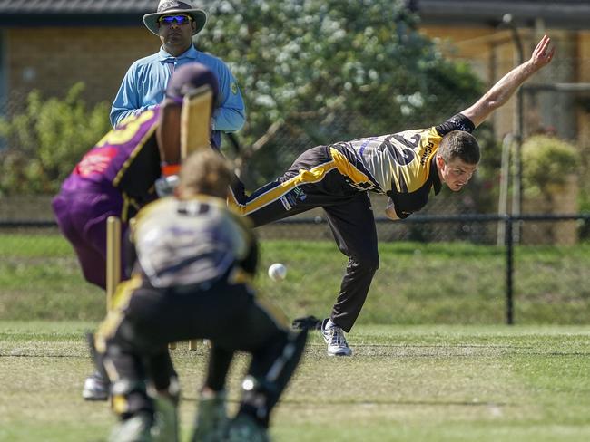 Josh Fisher bowling for Mentone on Saturday after making a big impact with the bat. Picture: Valeriu Campan