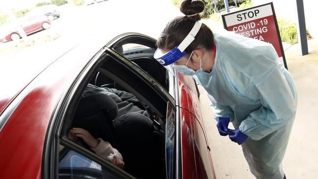 A tester prepares to take a swab at a Ballarat drive-through centre. Picture: Darrian Traynor/Getty Images