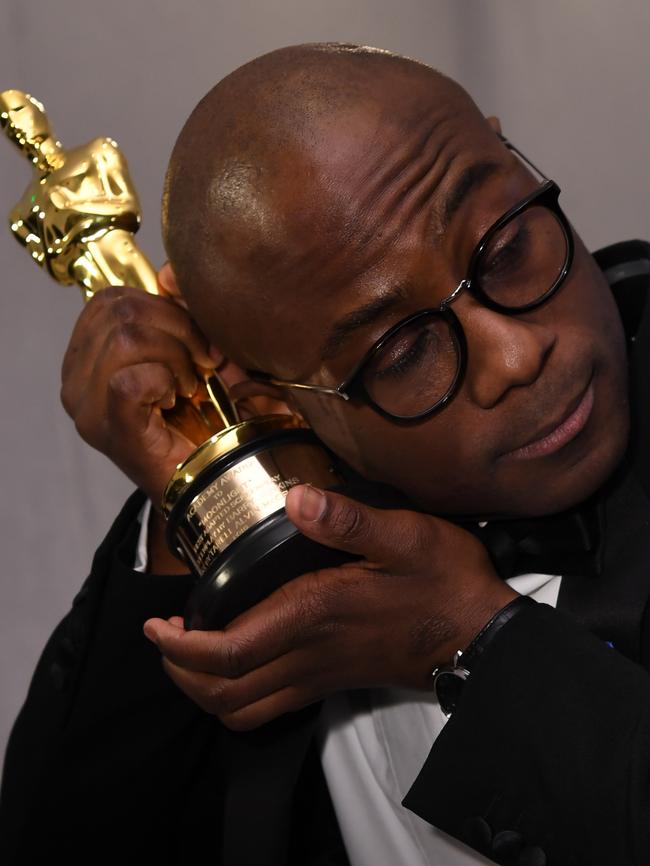 Moonlight director Barry Jenkins finally gets a hold on that statue at the Governors Ball. Picture: AFP/Angela Weiss