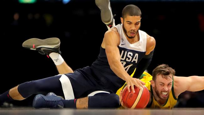 Team USA’s Jayson Tatum and the Boomers’ Nicholas Kay compete for the ball in Melbourne on Saturday night. Picture: Stuart McEvoy/The Australian