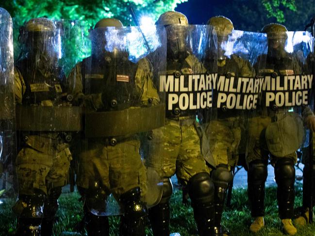 Military police officers outside of the White House after protests escalated. Picture: AFP