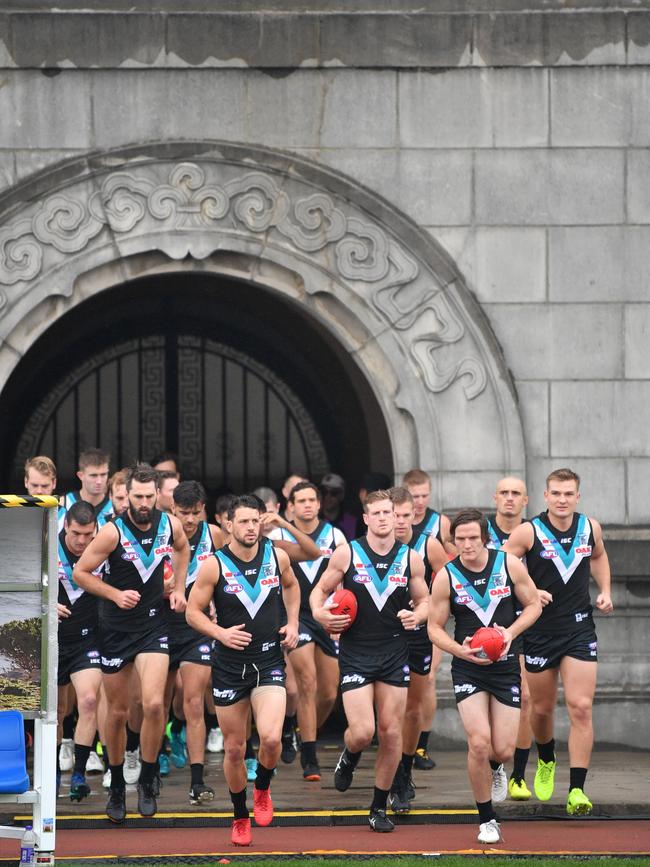 Power players run onto the field to take on the Suns at Jiangwan Stadium in Shanghai last year. Picture: AAP Image/David Mariuz