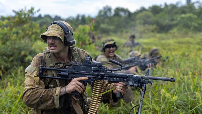 Australian Army soldiers from the 1st Battalion, The Royal Australian Regiment conduct a company assault during the 147th rotation of Rifle Company Butterworth in Pulada, Malaysia.