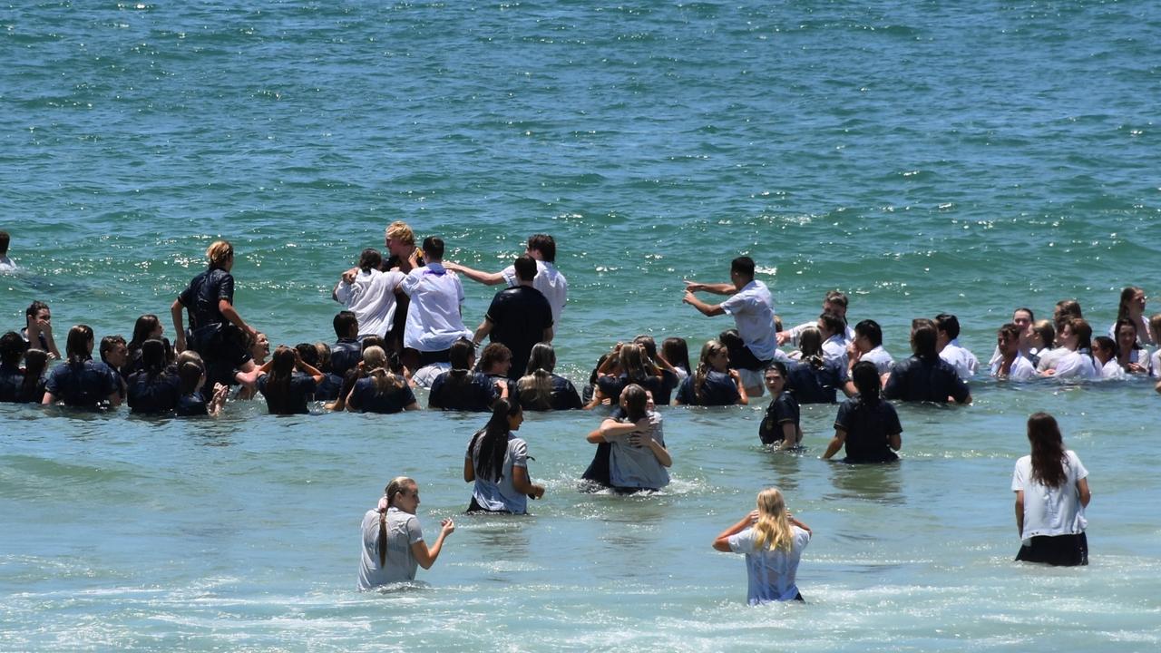 Year 12 graduates from schools across the Sunshine Coast hit to the water at Mooloolaba Beach to celebrate the end of their schooling. Photo: Mark Furler