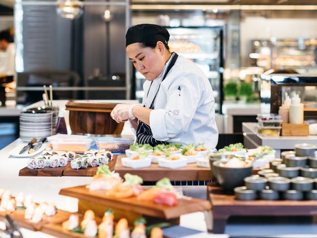 A chef prepares handmade fresh sushi and sashimi at the hotel.