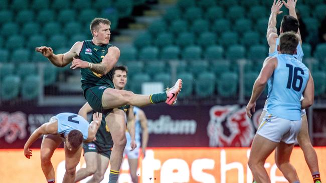 Tasmania vs NSW / ACT at University of Tasmania Stadium on Saturday 20th July 2024. Sam Siggins takes a shot for Tasmania.Picture: Linda Higginson / AFL Tasmania