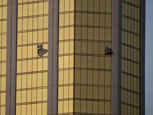 Drapes billow out of broken windows at the Mandalay Bay resort and casino on the Las Vegas Strip following the mass shooting. Picture: AP