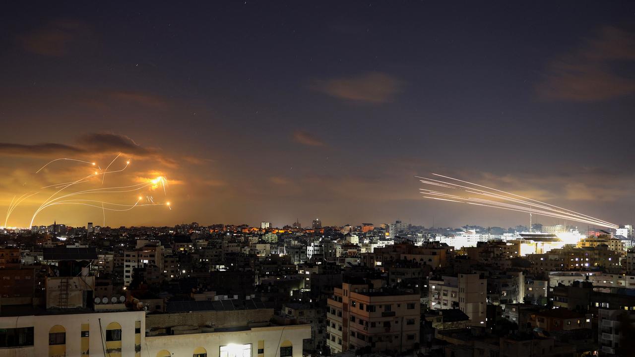 Rockets fired from the Gaza City being intercepted by Israel's Iron Dome defence missile system. Picture: AFP