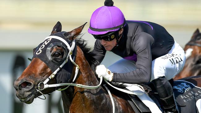 Jockey Mark Du Plessis rides Boomtown Lass to victory in race 5, the BenchMark 78 Handicap, during The Metro Races at Doomben Racecourse in Brisbane, Saturday, November 30, 2019. (AAP Image/Albert Perez) NO ARCHIVING, EDITORIAL USE ONLY