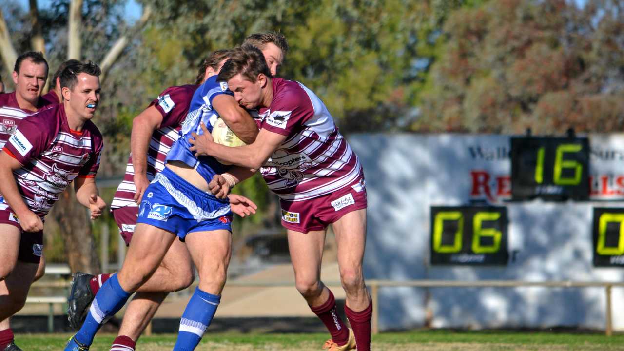 TOUGH GAME: Al Lobb and Jack Rowbotham go hard up against each other. Picture: Molly Hancock