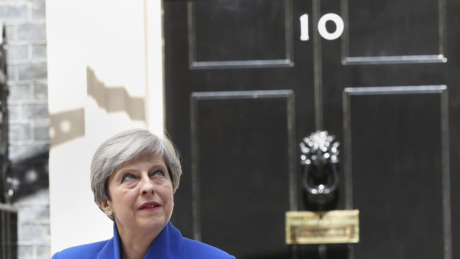 Theresa May outside 10 Downing Street after returning from visiting the Queen. Picture: AP
