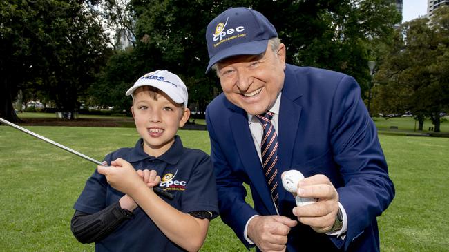 Tyler Parfuss from the Cerebral Palsy Education Centre in Glen Waverley with Peter Hitchener ahead of the annual charity golf day. Picture: Andy Brownbill