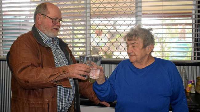 BOTTOMS UP: Joe Abbott and Phyliss Brown enjoying the first taste of Tara's potable water straight from the kitchen tap. Picture: Kate McCormack