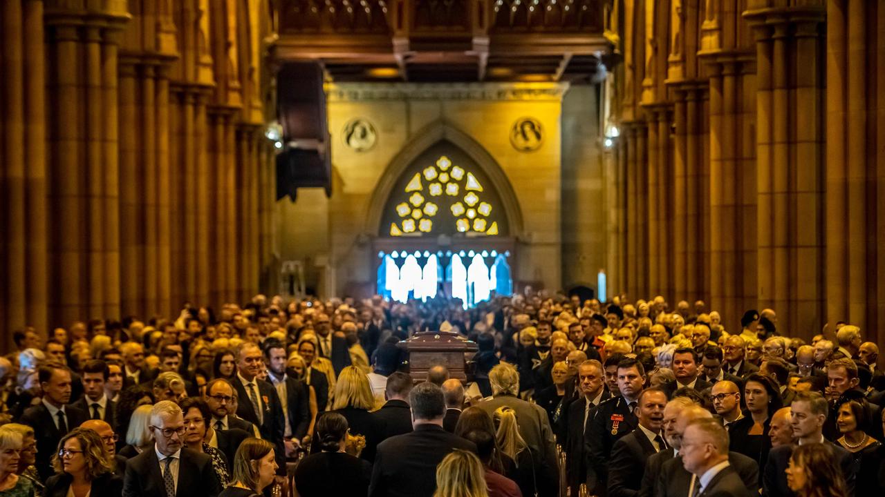 A coffin containing the remains of late Australian Catholic Cardinal George Pell being carried out of St. Mary's Cathedral during his funeral in Sydney. Picture: Giovanni Portelli/AFP