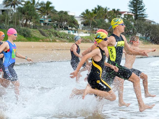 RACE START: Give it a go racers enter the water at the Bargara Triathlon.