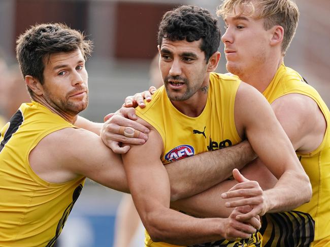 Trent Cotchin of the Tigers and Tom Lynch of the Tigers tackles Marlion Pickett of the Tigers during an AFL Richmond Tigers training session at Swinburne Centre in Melbourne, Tuesday, June 16, 2020. (AAP Image/Michael Dodge) NO ARCHIVING