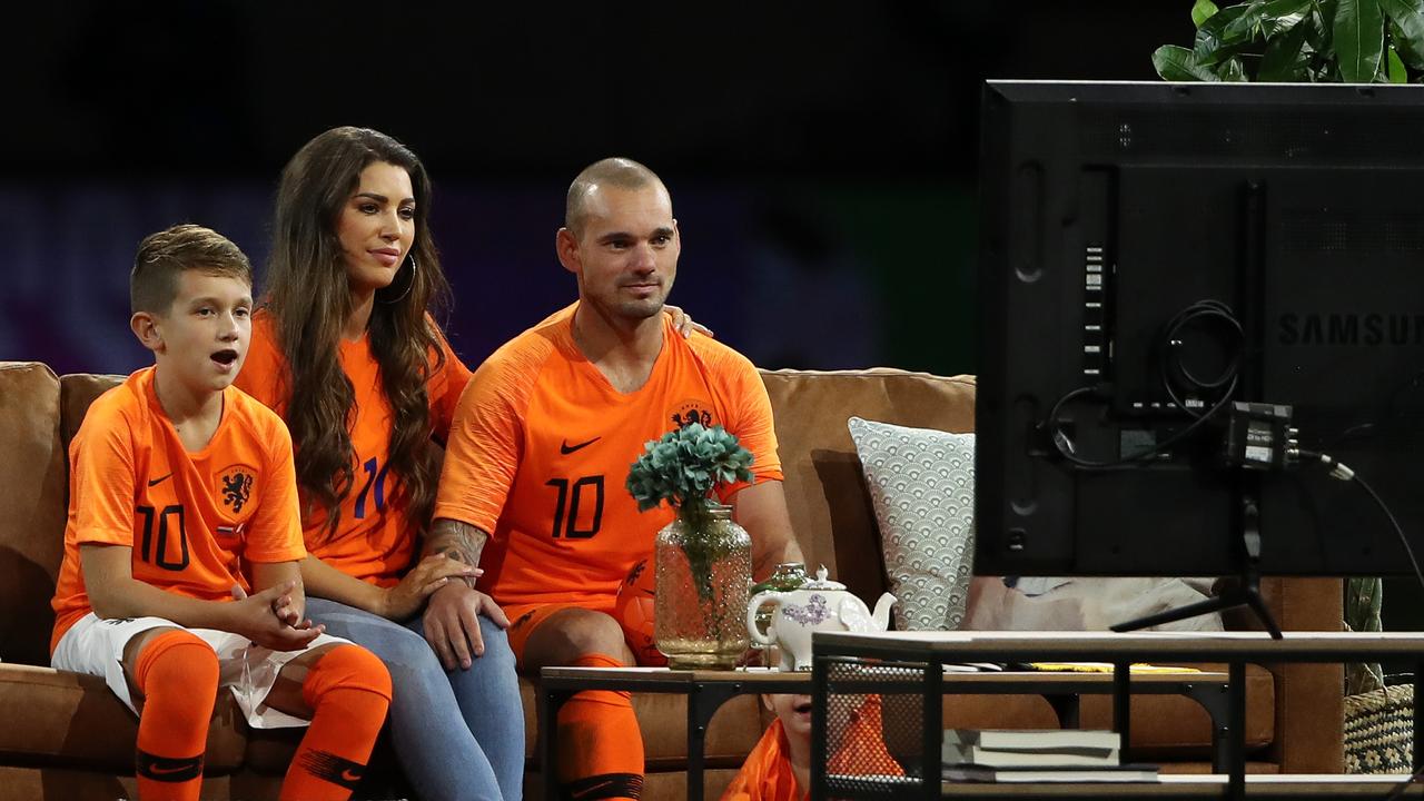 Wesley Sneijder watched his career highlights from the sofa in the middle of the pitch.