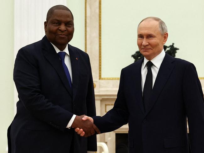 Russian President Vladimir Putin and President of the Central African Republic Faustin-Archange Touadera shake hands during a meeting at the Kremlin in Moscow on January 16, 2025. (Photo by Evgenia NOVOZHENINA / POOL / AFP)