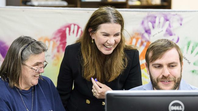 Groom Independent Suzie Holt (centre) looks over early numbers with Penelope Lilford and Thomas Murphy at campaign headquarters on federal election night. Picture: Kevin Farmer