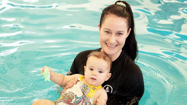 Toddlers receiving free swimming lessons from Bluefit Swimming at the Cotton Tree pool. Pictured, Hannah Searle with 11 month old Melia Head. Photo: Patrick Woods.