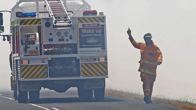 Fire fighters look to contain a fire along  Elderslie Road in Elderslie.  Picture: Zak Simmonds