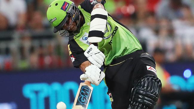 Jason Sangha lofts over cover during BBL match for the Sydney Thunder. Picture. Phil Hillyard