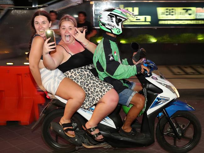 Young Australians without helmets on scooters in the Kuta nightclub district during schoolies. Picture: Liam Kidston