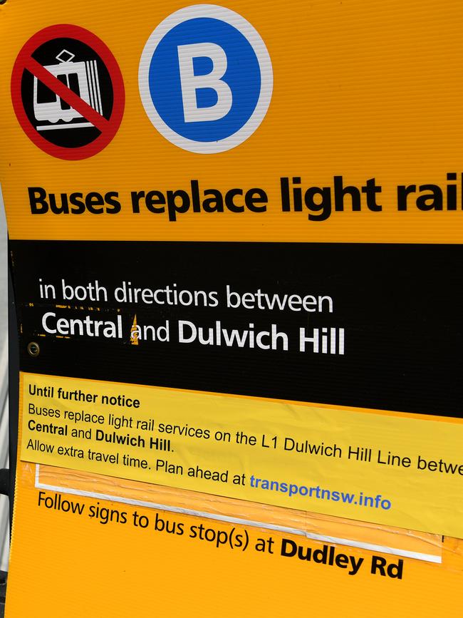 Signs direct light rail passengers to buses.